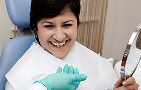 Laughing woman in dental office