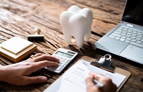 An insurance agent discussing dental insurance with a patient