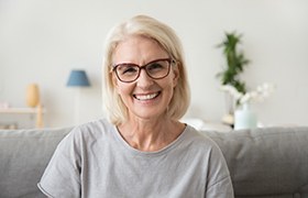 Woman who replaced her missing teeth with a dental bridge. 