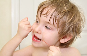 Young boy brushing his teeth