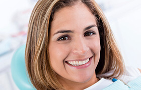 Young woman smiling in dental chair