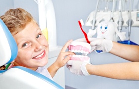 Young girl at dentist for dental sealants.