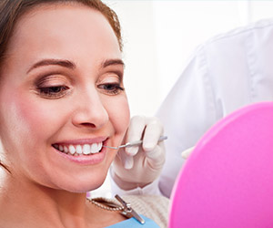 Smiling woman during dental exam