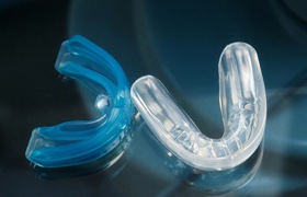 Blue and clear mouthguards from dentist.