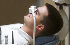 man with white mask over his nose 