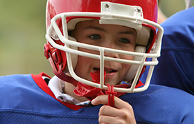 Young boy in football uniform