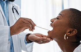  A woman getting an oral cancer screening