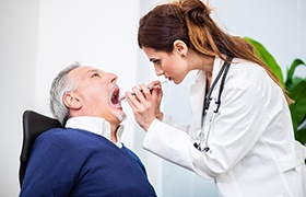 A man getting an oral cancer screening