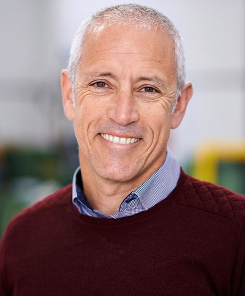 Smiling senior man in red sweater