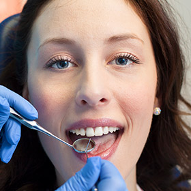 Woman receiving dental checkup