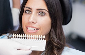 woman smiling with a set of veneers 