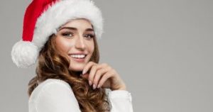 Smiling woman in a Santa hat 