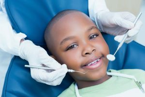 little boy visiting a children's dentist in Aurora