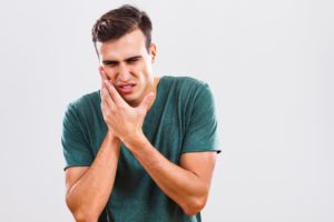 man with toothache who needs emergency dentist