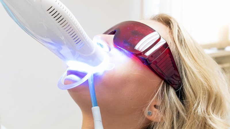 Woman getting teeth whitening in Aurora