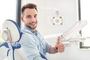 man giving a thumbs up after seeing an emergency dentist in Aurora