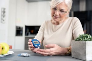 person testing blood sugar