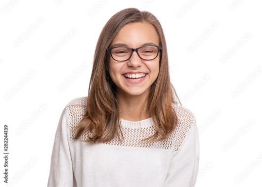 Smiling teen thinking about cosmetic dentistry