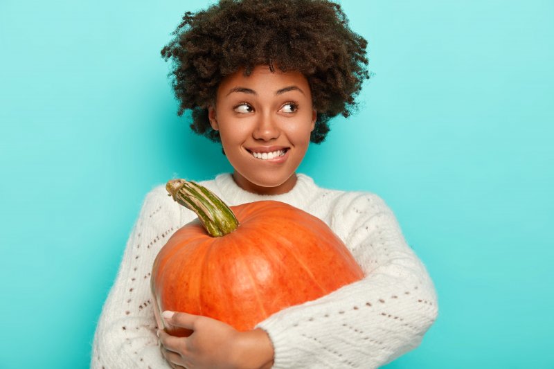 woman smiling during Halloween in Aurora