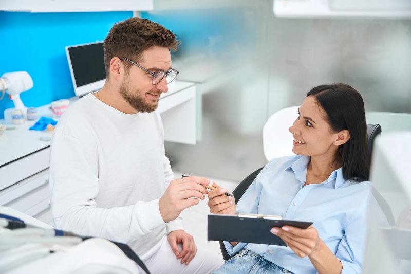 patient talking with a dentist